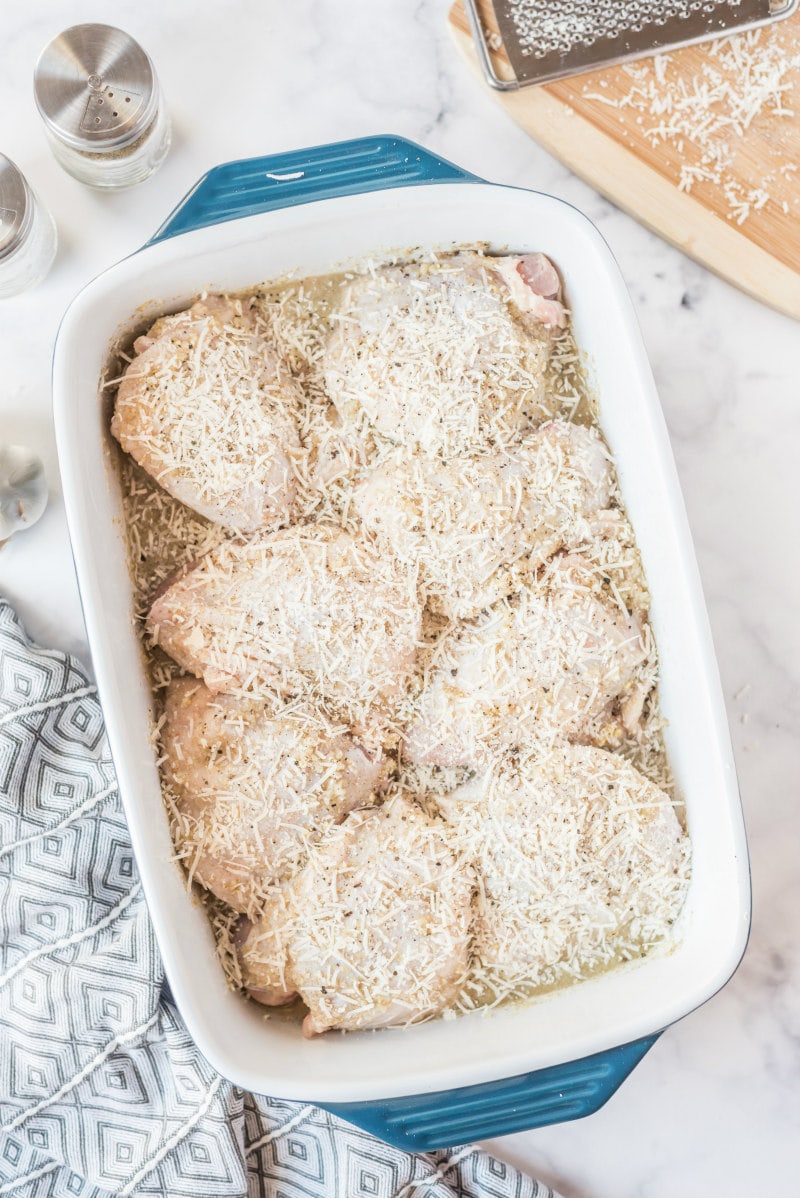 lemon parmesan chicken in white casserole dish ready for oven