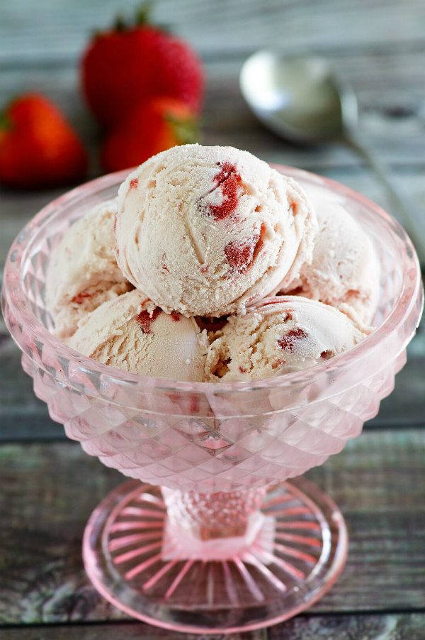 Scoops of No Cook Fresh Strawberry Ice Cream in a pink dish