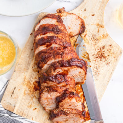 sweet and tangy roasted pork tenderloin sliced on board