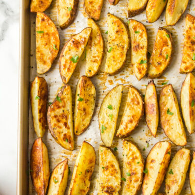 thick cut oven roasted fries on a baking sheet