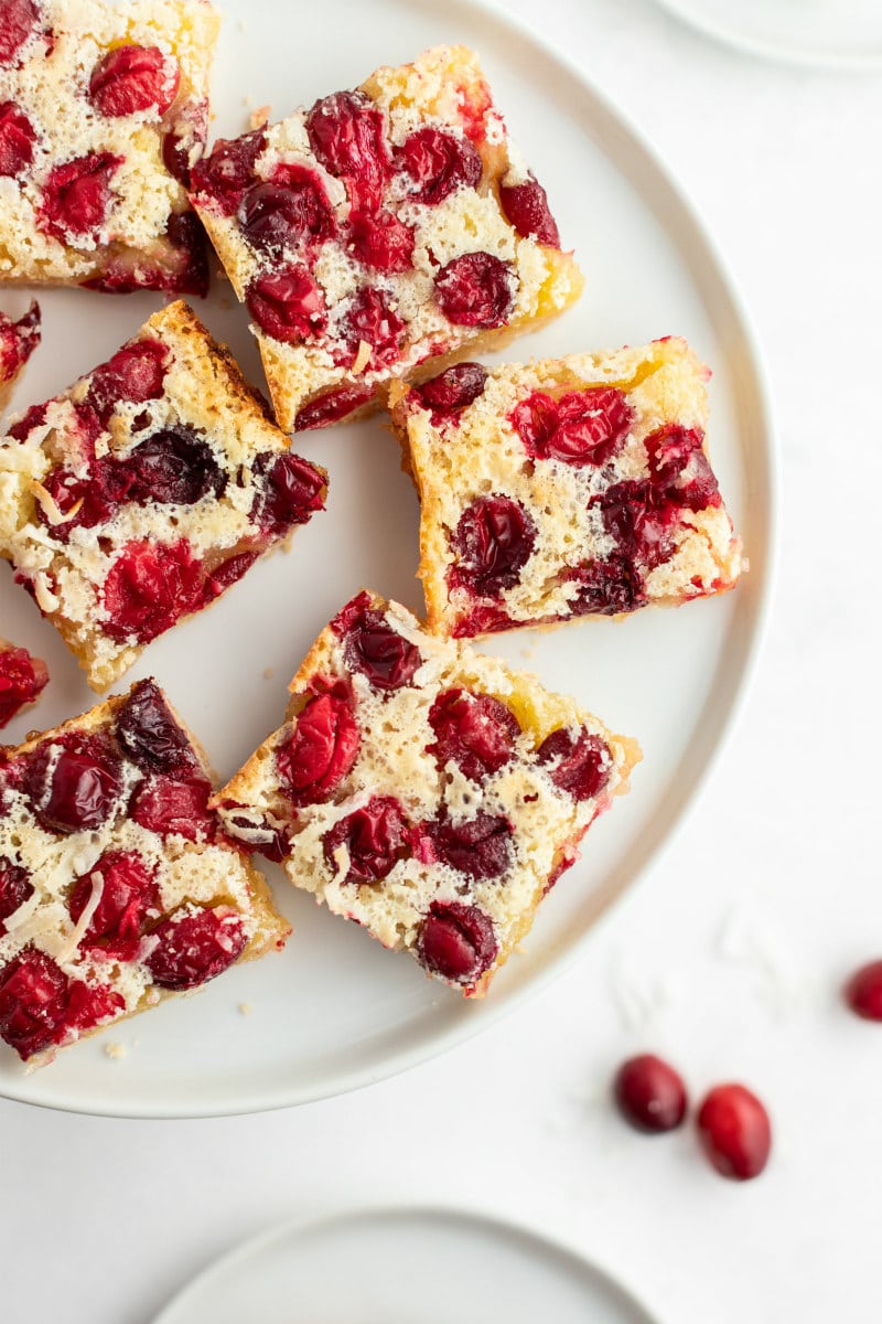 cranberry coconut squares on a white platter