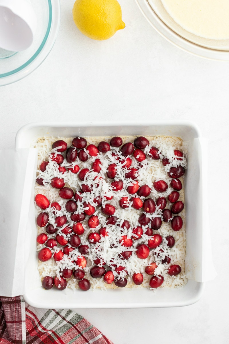process of making cranberry coconut squares- filling in pan