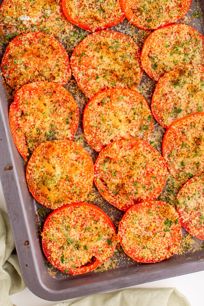 Tomatoes with Asiago on a baking sheet