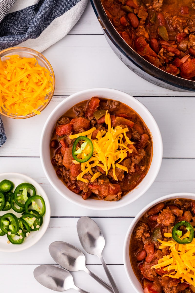 bowls of chili with cheese