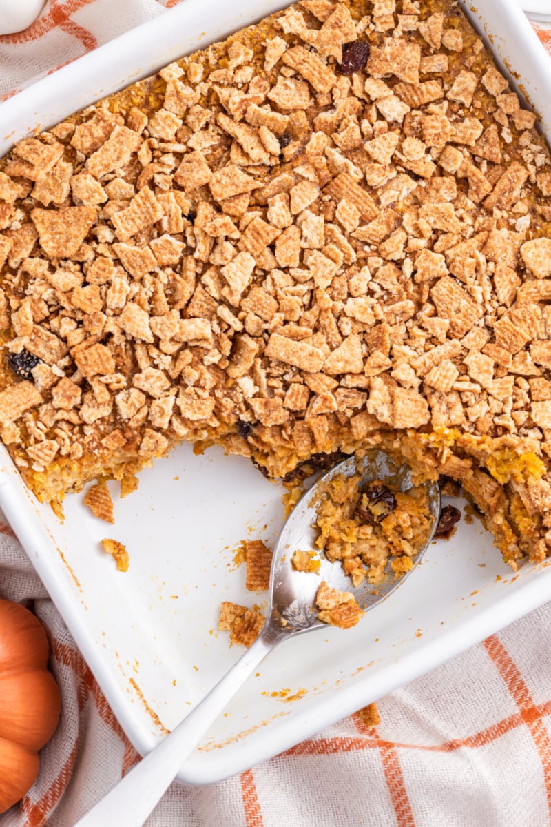 pan of pumpkin oatmeal with piece taken out