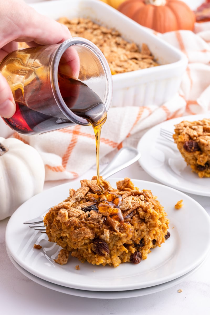 syrup poured over slice of baked pumpkin oatmeal