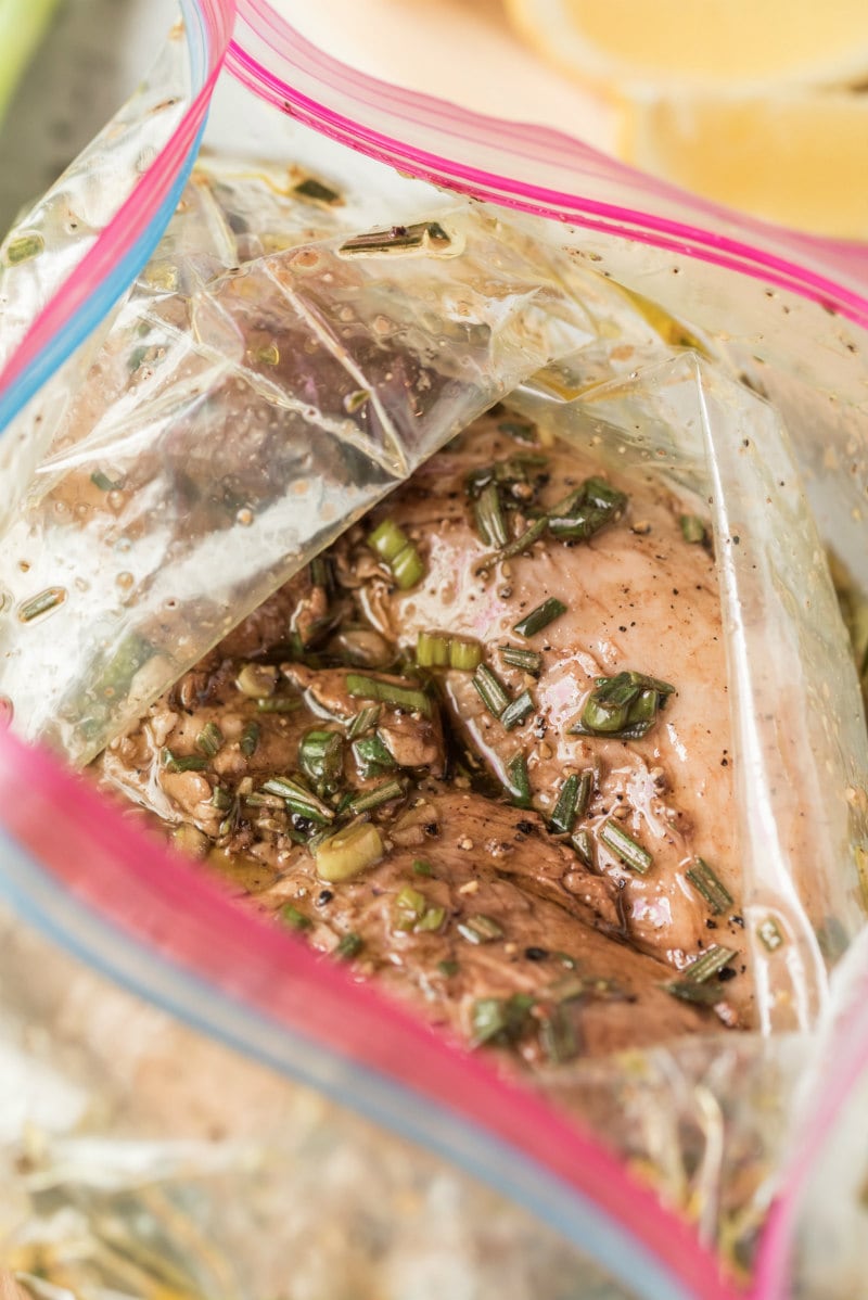 pork tenderloin marinating in a plastic bag