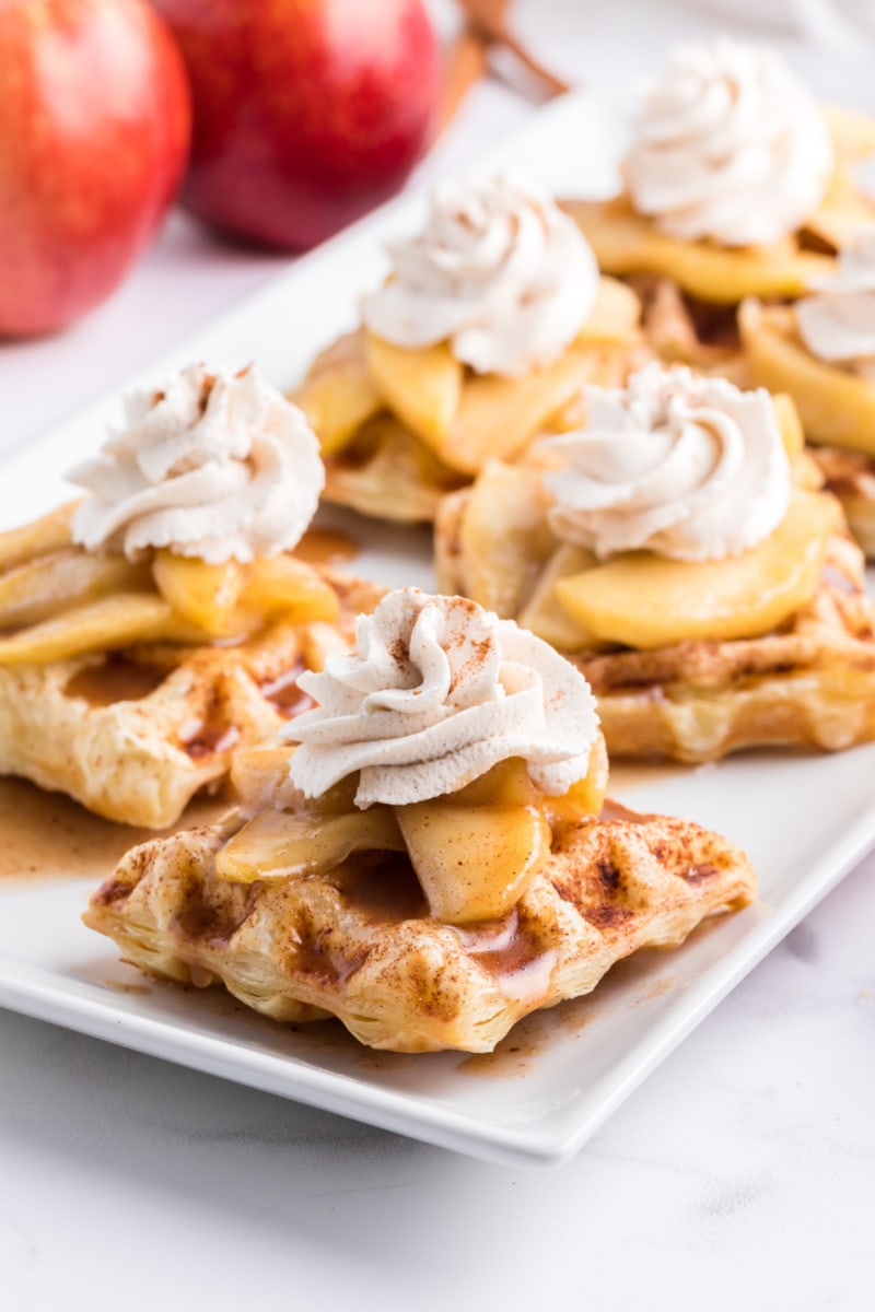 caramelized apple waffle pastries on white plate