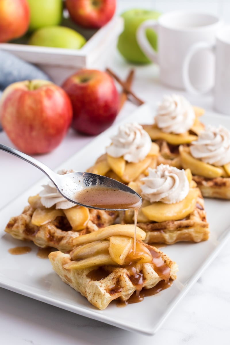 spooning juices onto caramelized apple waffle pastries