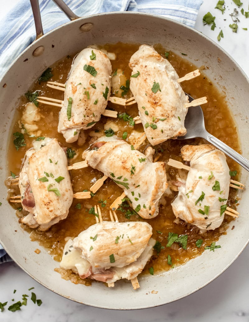 pan filled with cooked chicken saltimbocca