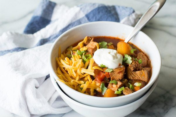 Chicken and Butternut Squash Chili recipe from RecipeGirl.com Chicken Butternut Squash Chili in a bowl with spoon