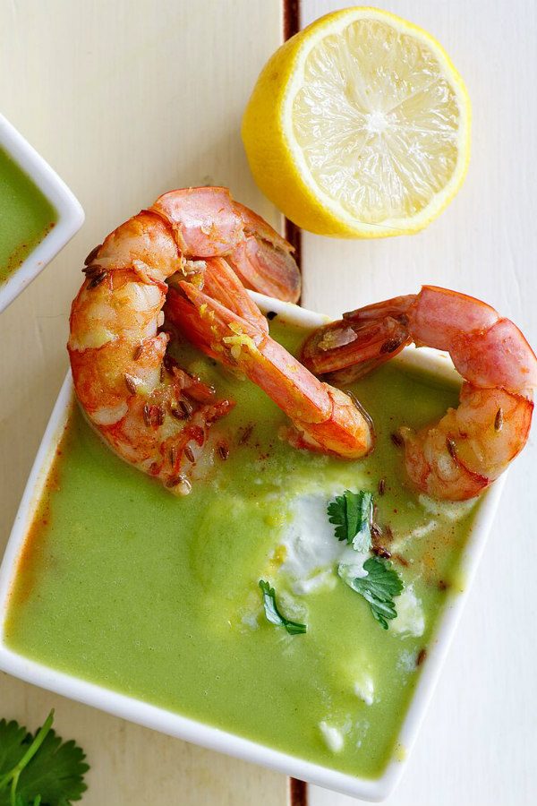 Bowl of Chilled Zucchini Soup with Shrimp and lemon