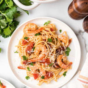 serving on plate of chipotle beer shrimp pasta