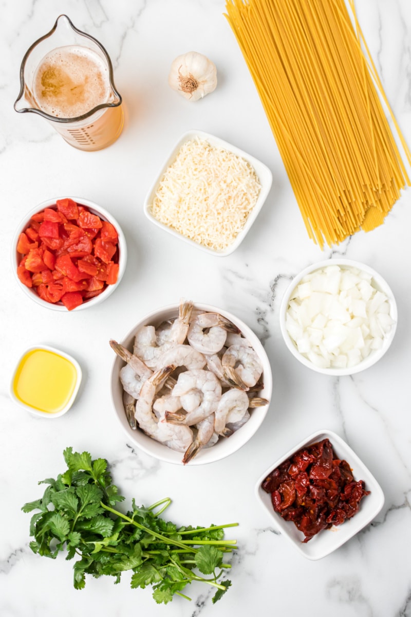 ingredients displayed for making chipotle beer shrimp pasta