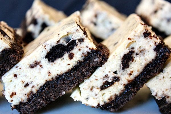 cookies and cream cheesecake bars stacked sideways