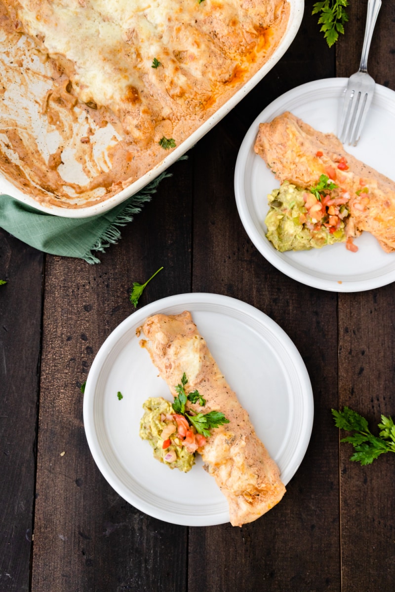 servings of enchiladas on two plates