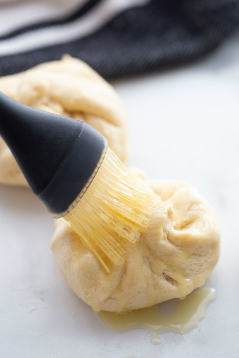 brushing crescent chicken with butter