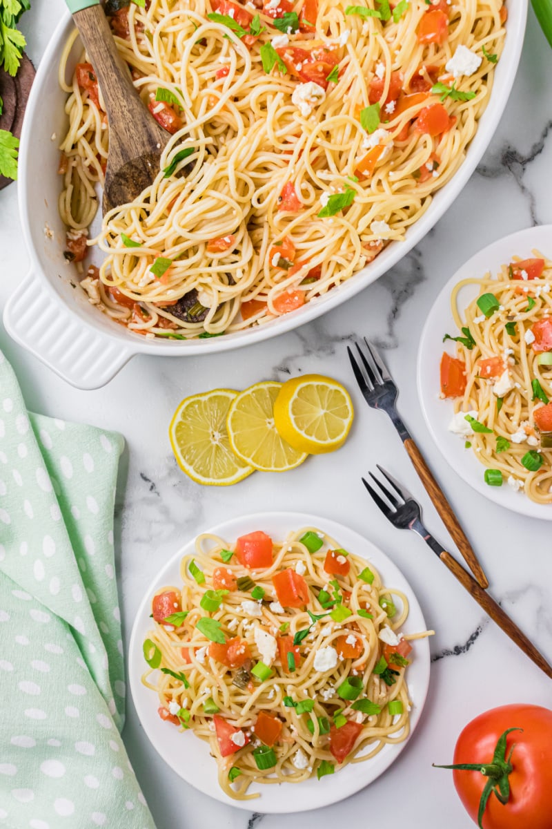 greek spaghetti in a serving dish and on a plate