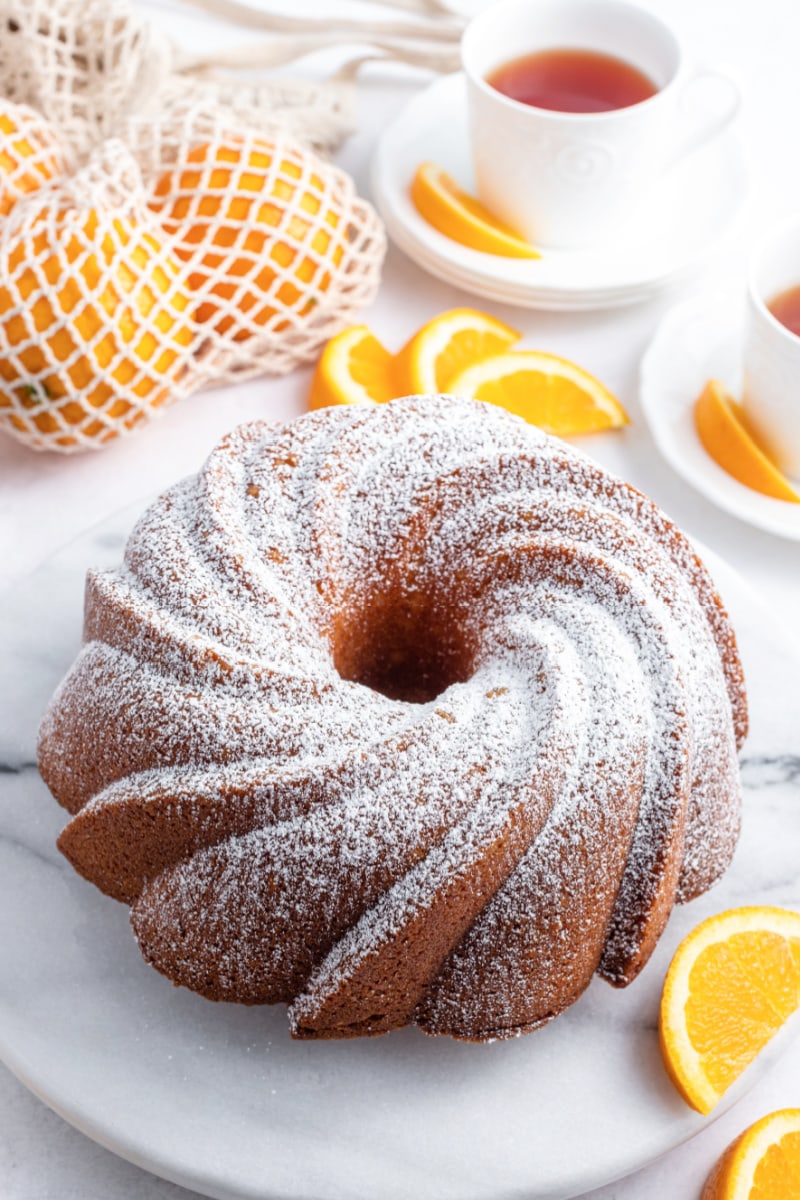 orange bundt cake dusted with powdered sugar