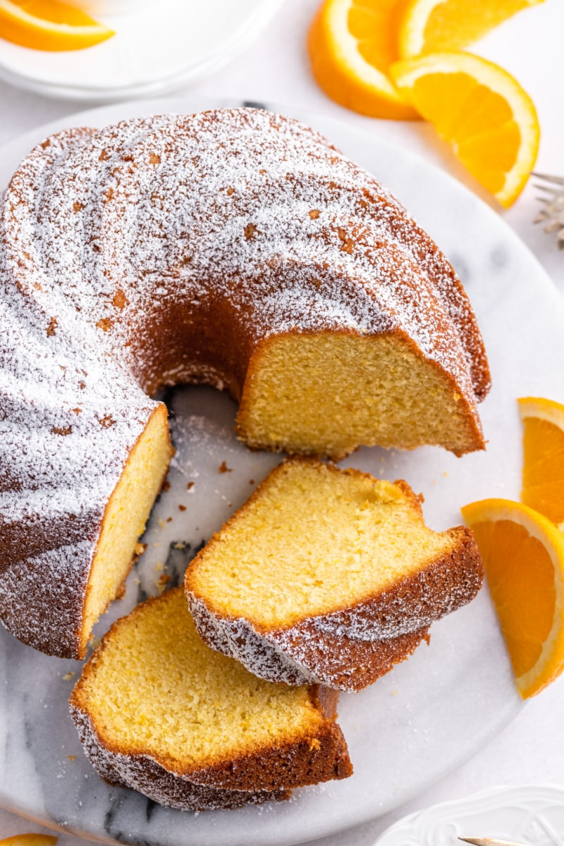 orange bundt cake cut into slices