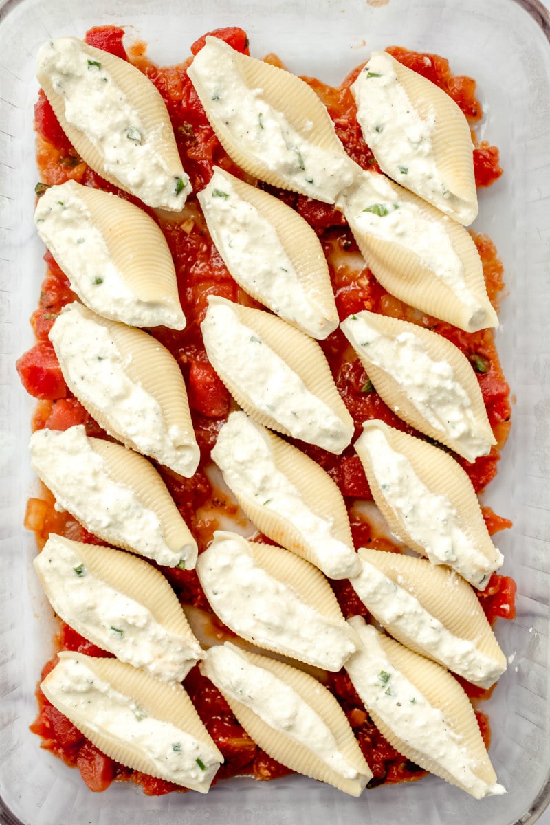 pasta shells filled with cheese in a casserole dish