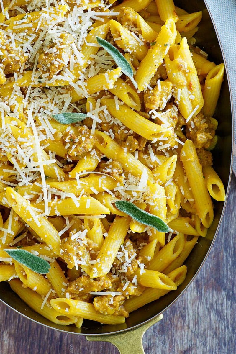 Pasta with Pumpkin and Sausage, topped with shredded Parmesan cheese