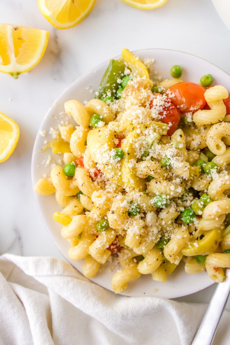 pasta with spring vegetables serving on a plate