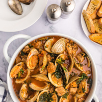 pot of pork stew with clams and mussels