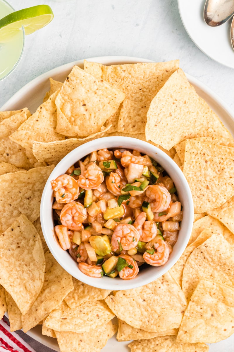 shrimp ceviche in a bowl surrounded by tortilla chips