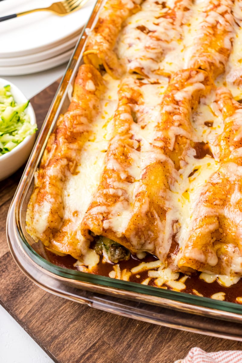 zucchini beef enchiladas in a baking dish