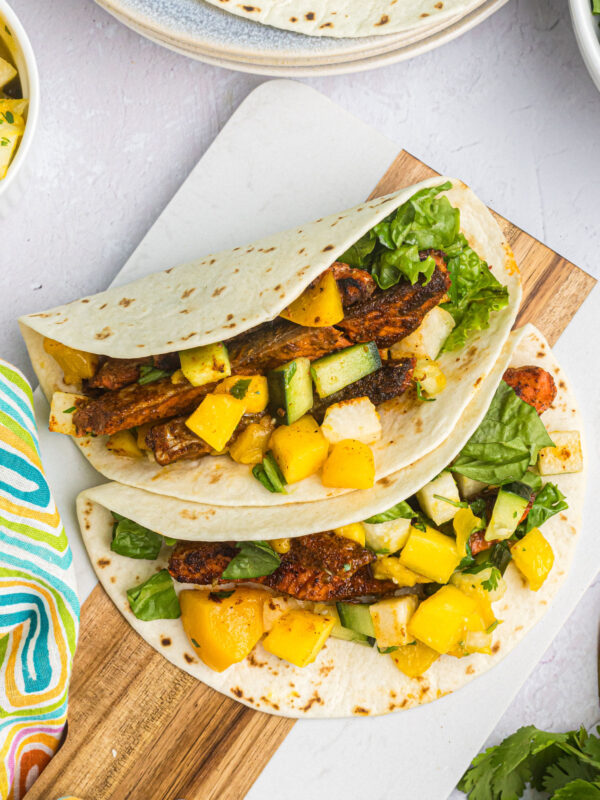 two blackened salmon tacos on plate