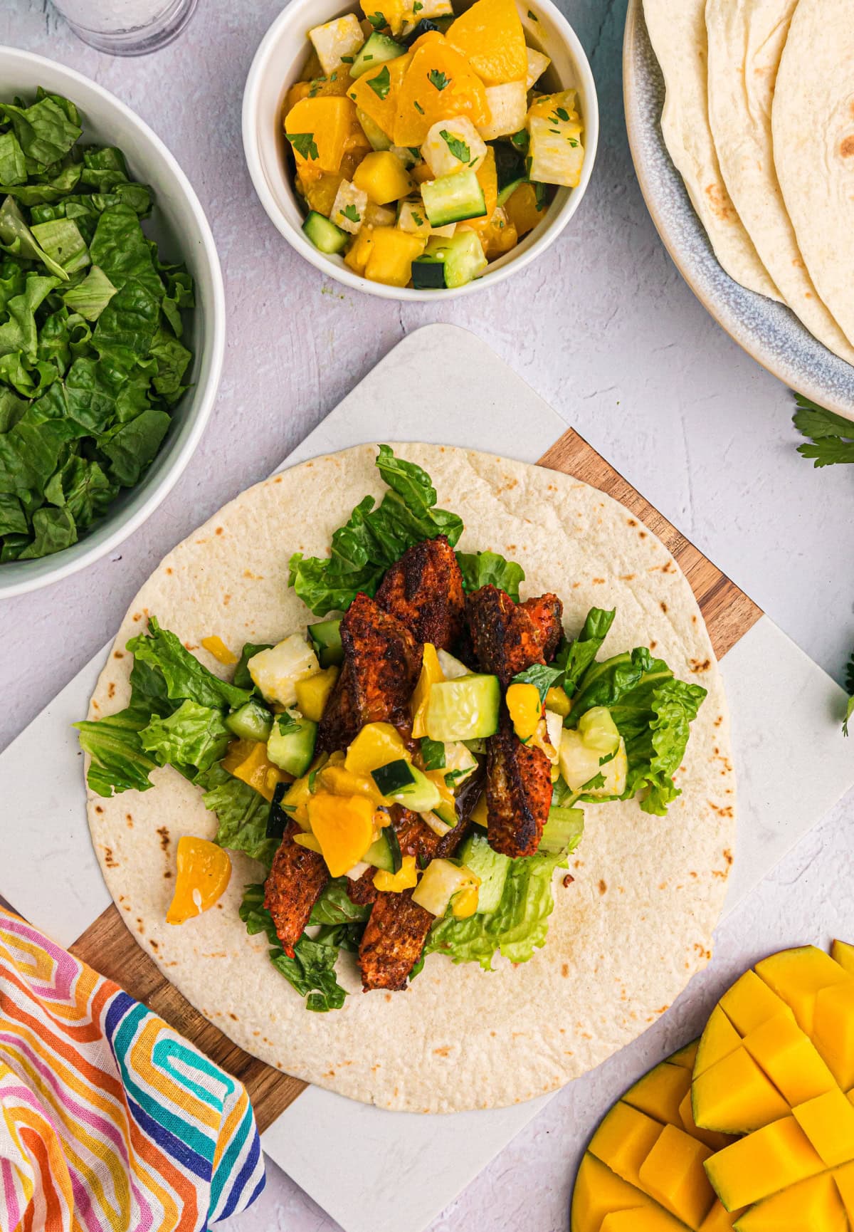 Blacked Salmon Tacos with Mango Salsa recipe from RecipeGirl.com : fish tacos open faced blackened salmon taco