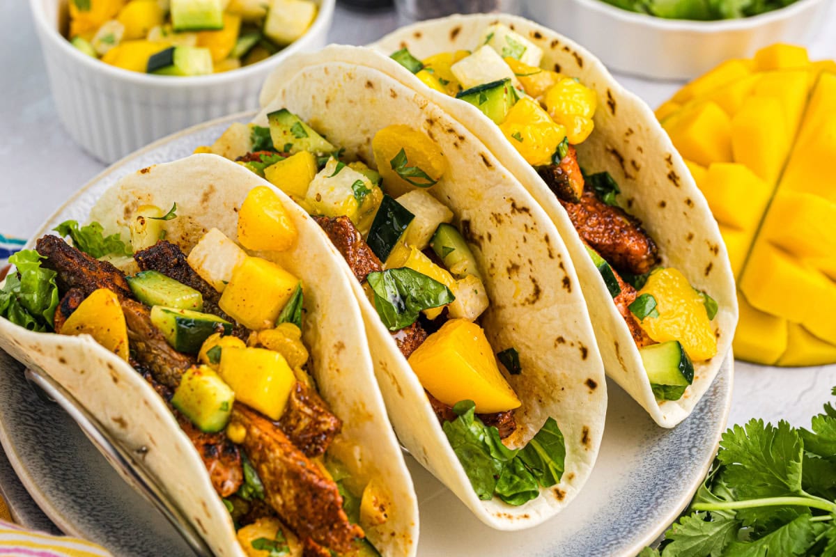 Blacked Salmon Tacos with Mango Salsa recipe from RecipeGirl.com : fish tacos three blackened salmon tacos