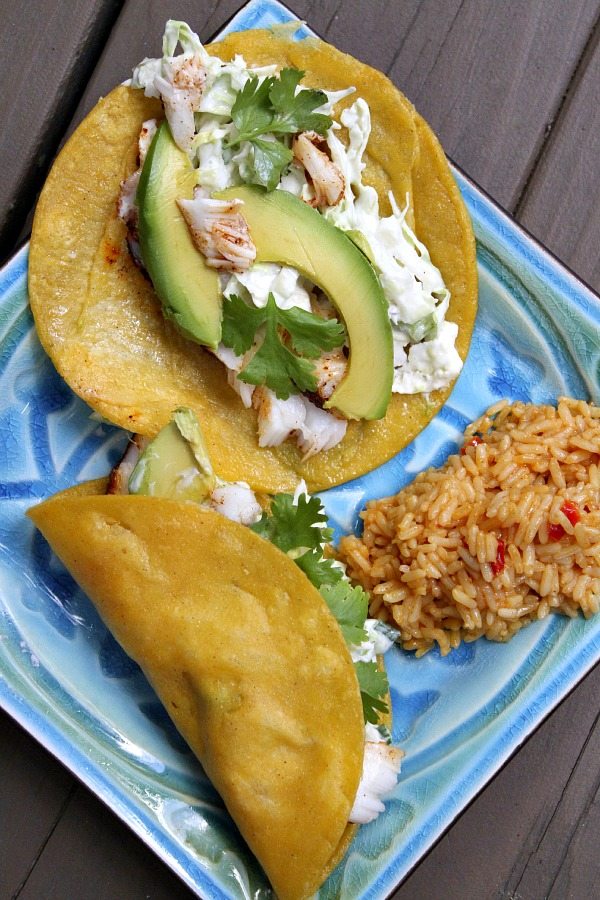 Cedar Planked Grilled Halibut Tacos on a blue plate with rice