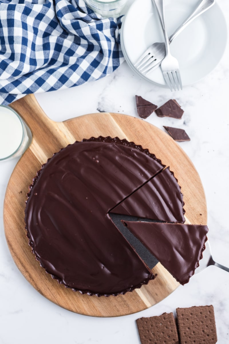 slice being taken out of chocolate tart