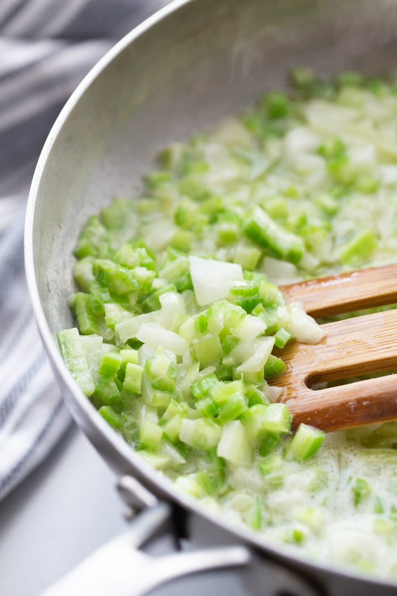cooking celery with butter in skillet