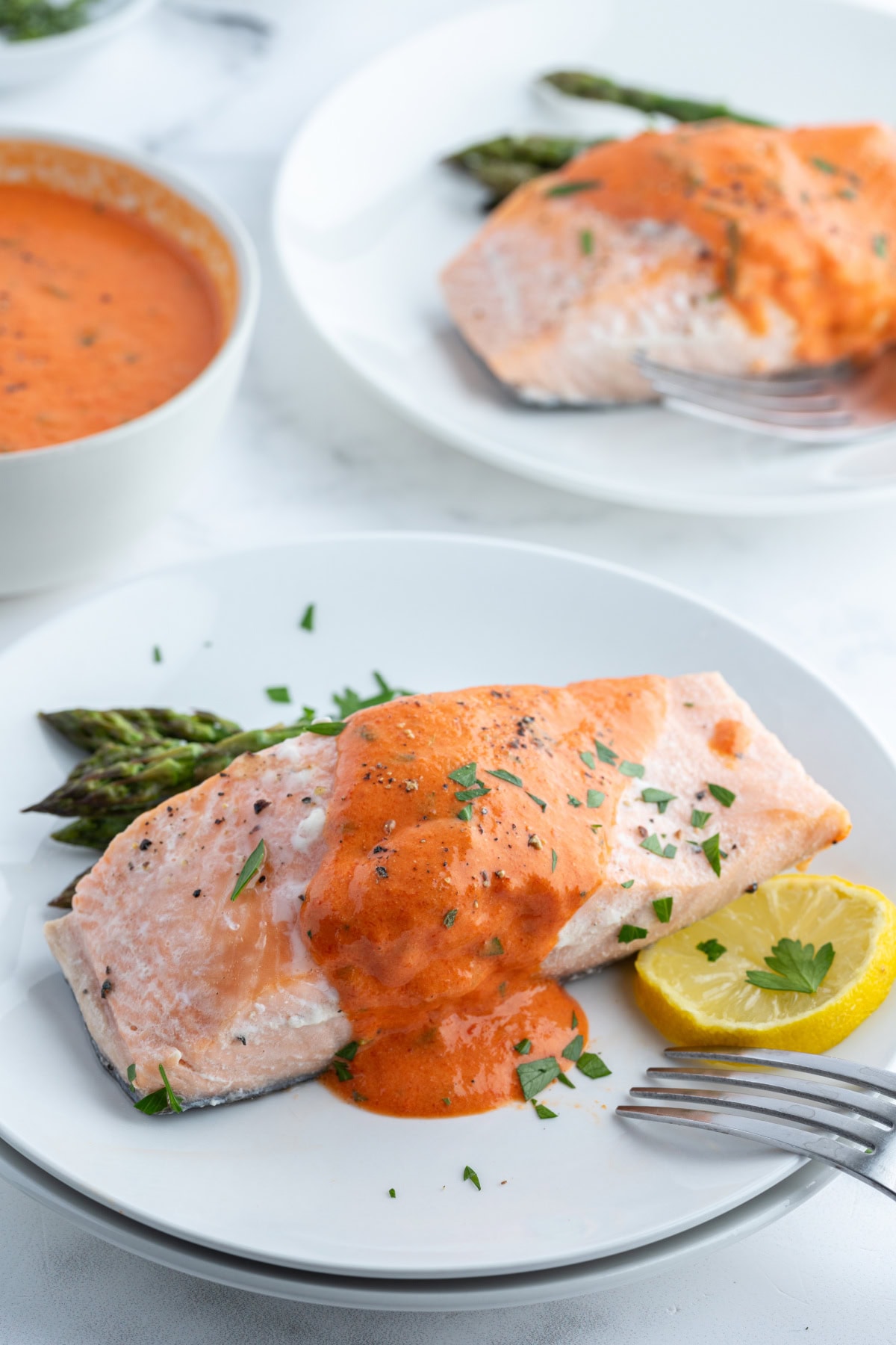 Summertime is the perfect time to serve up this Cold Poached Salmon recipe. It's delicious with a side of roasted red pepper- mustard sauce. cold poached salmon on plate with mustard sauce on top