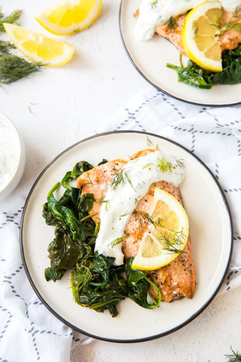 serving of Grilled Salmon with Spinach and Yogurt Dill Sauce