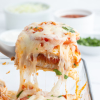 spatula scooping out serving of fish taco casserole