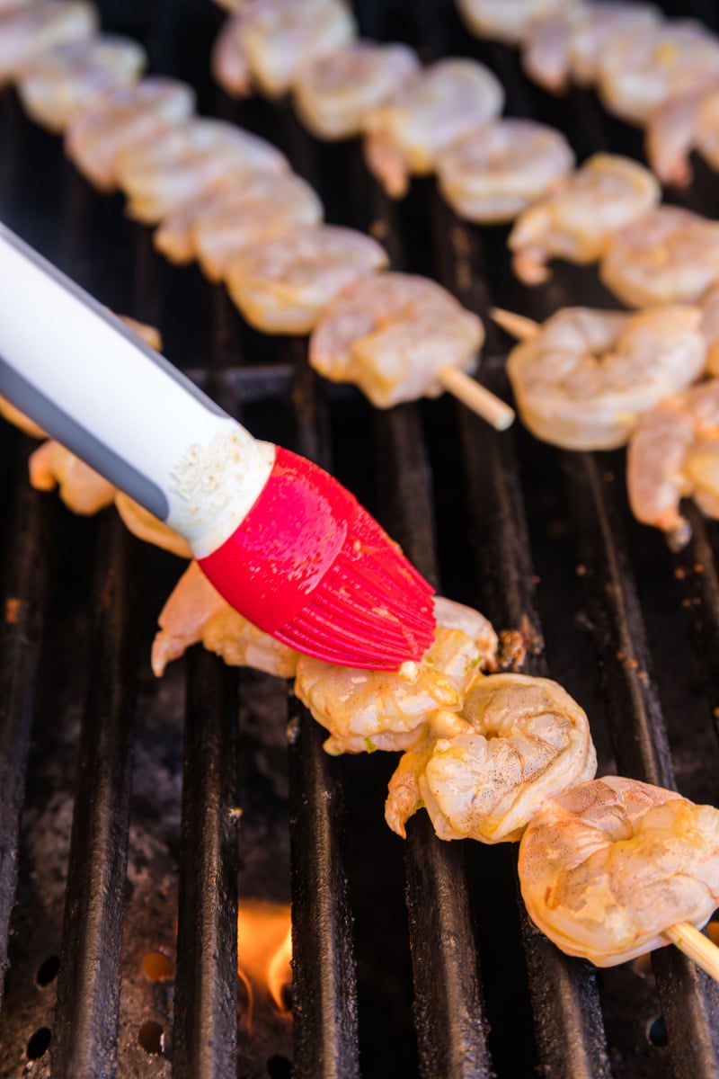 jalapeno lime shrimp skewer brushed with marinade on grill