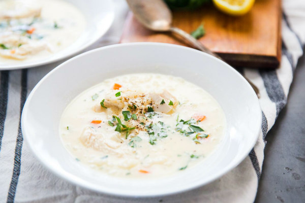 lemon chicken rice soup in a white bowl