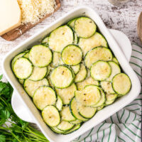 square white baking dish with parmesan zucchini slices