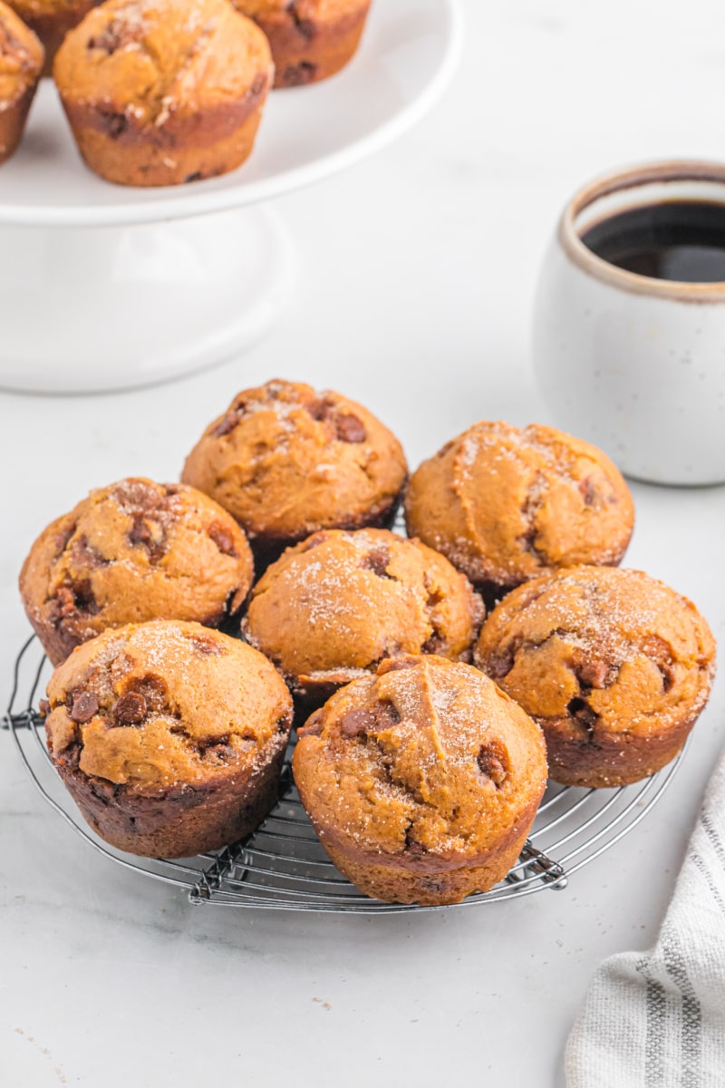 pumpkin cinnamon chip muffins on a baking rack