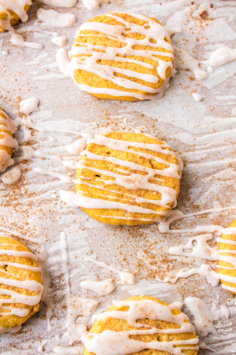 pumpkin shortbread cookies just iced on baking sheet