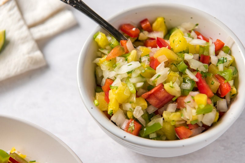 pineapple salsa in a white bowl