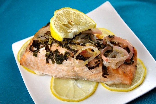 Salmon with lemon and basil on a plate