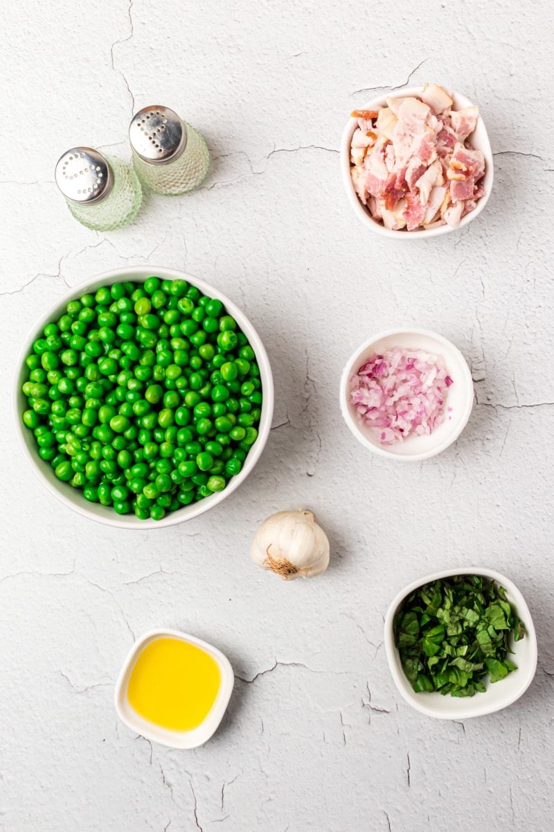 ingredients displayed for making sauteed peas with basil and bacon