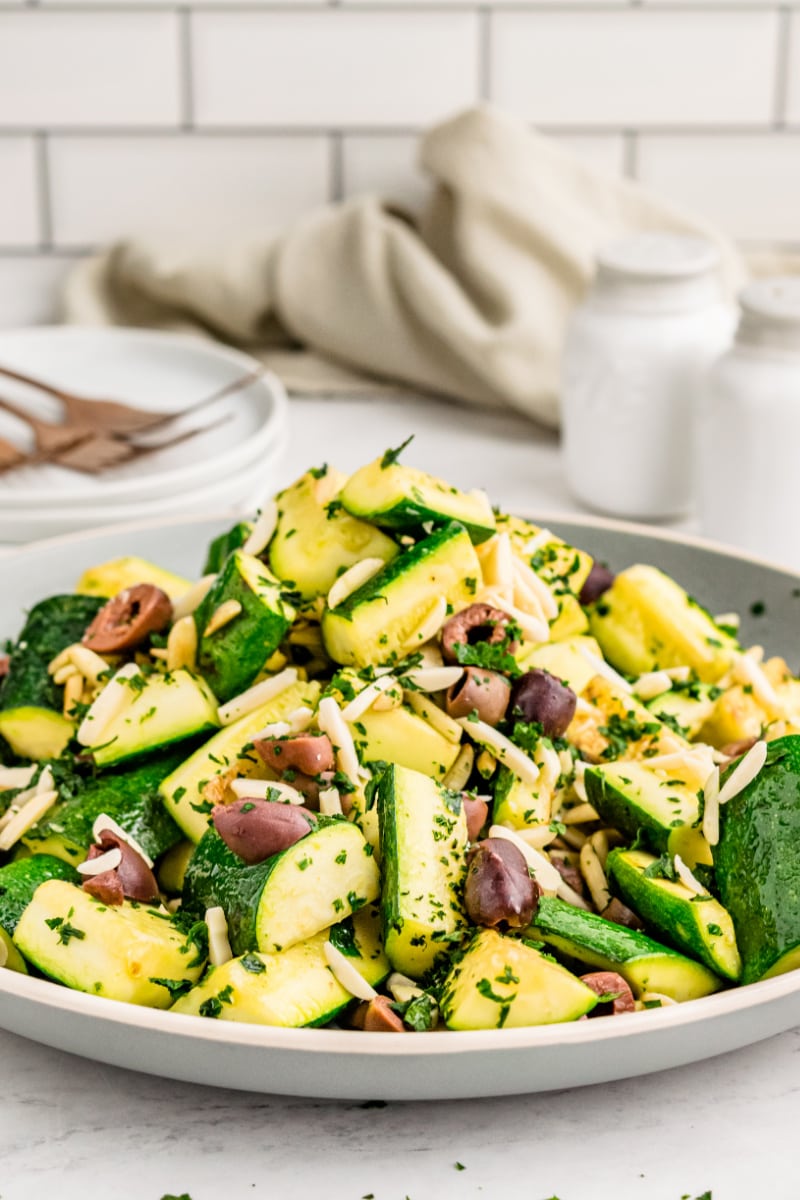 platter of sauteed zucchini with almonds and olives