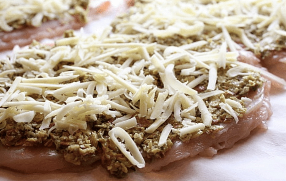 Chicken with Pumpkinseed Pesto and Butternut Sauce recipe from RecipeGirl.com #chicken #pumpkinseed #pepitas #pesto #butternutsquash #sauce #recipe #RecipeGirl chicken topped with shredded cheese
