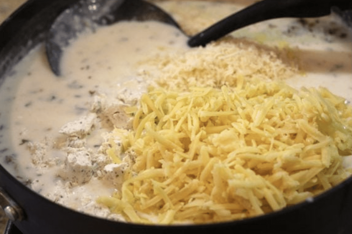 cheese sauce being made in pan